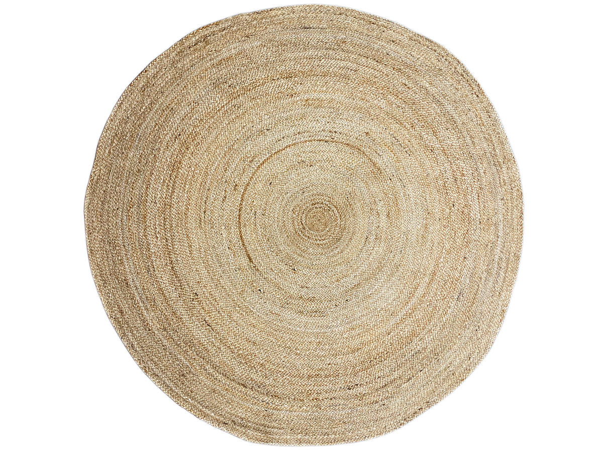 Round jute rug in a natural tone with an even spiral design