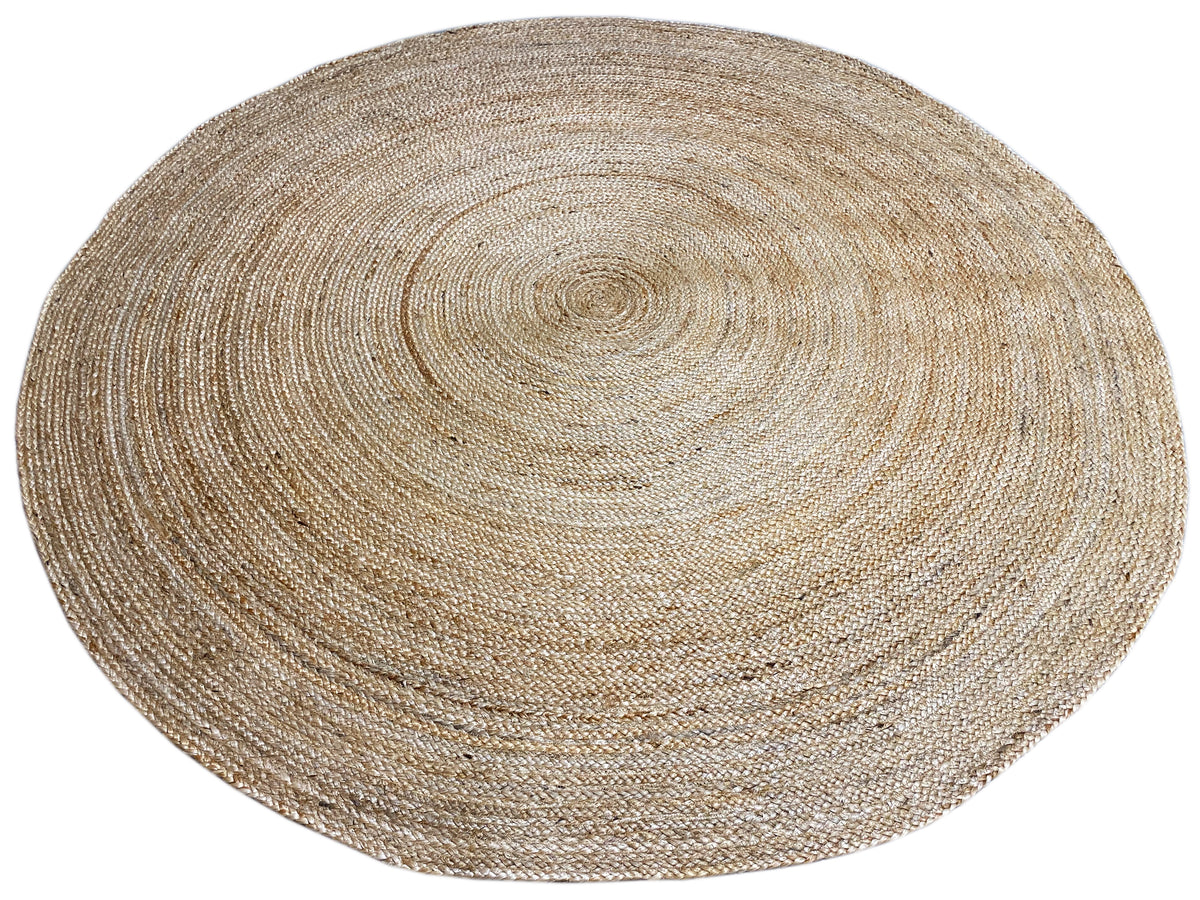 Round natural jute rug with a flat, spiral-woven pattern