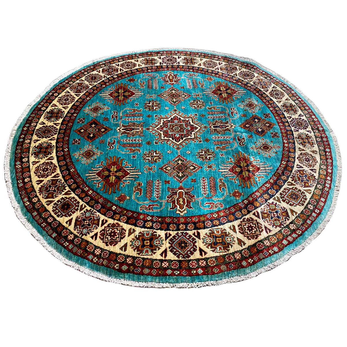 Round turquoise rug with a dense geometric pattern and a border-like hem