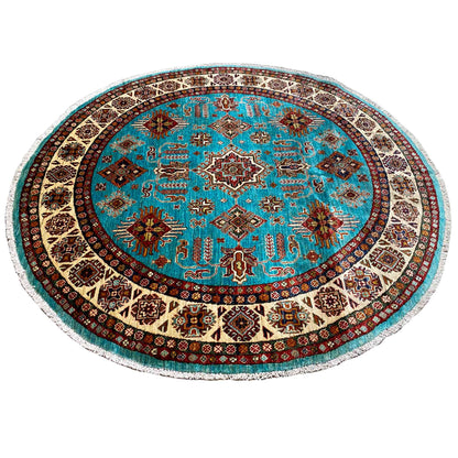 Round turquoise rug with a dense geometric pattern and a border-like hem