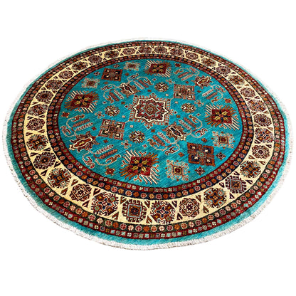 Round rug with a turquoise field and multicolored medallion design