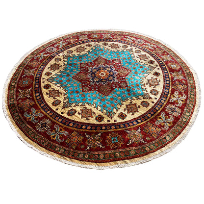 Round rug with a turquoise-red center motif, red medallion border, and fringe