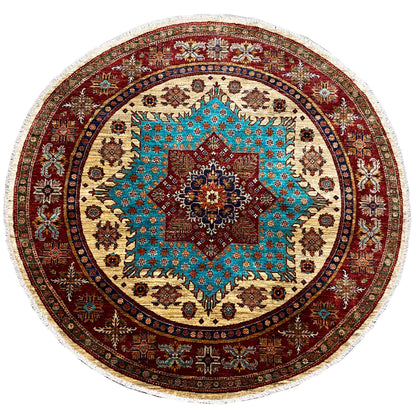 Round rug with a turquoise-red ornamental pattern, beige background, and fringed edge