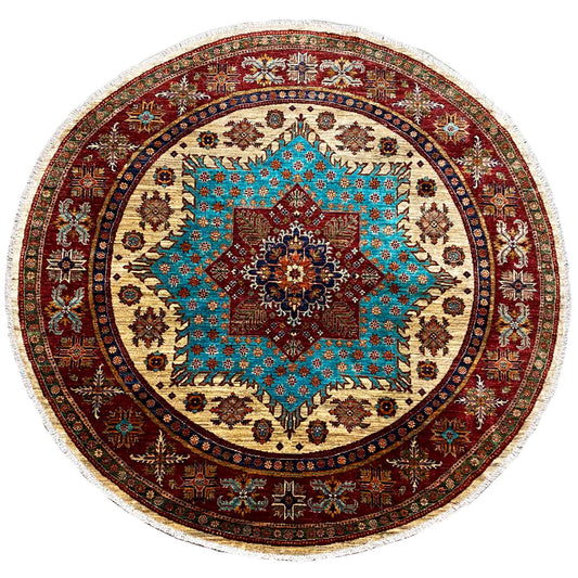 Round rug with a turquoise-red ornamental pattern, beige background, and fringed edge