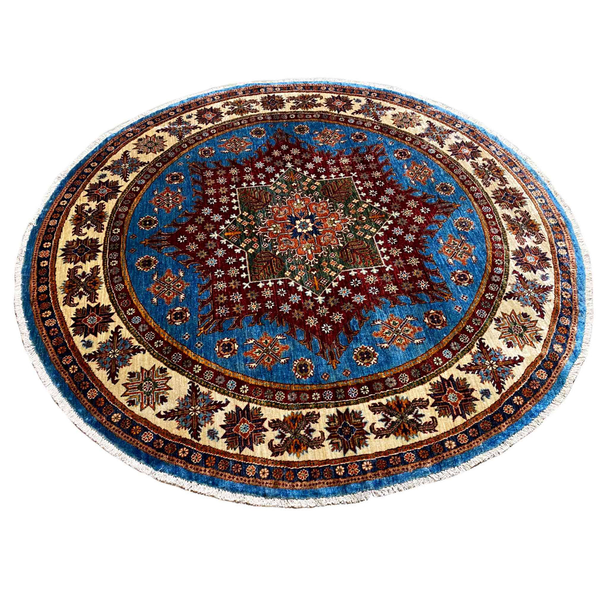 Round blue rug with a central ornamental star and intricately detailed raised design, multicolored