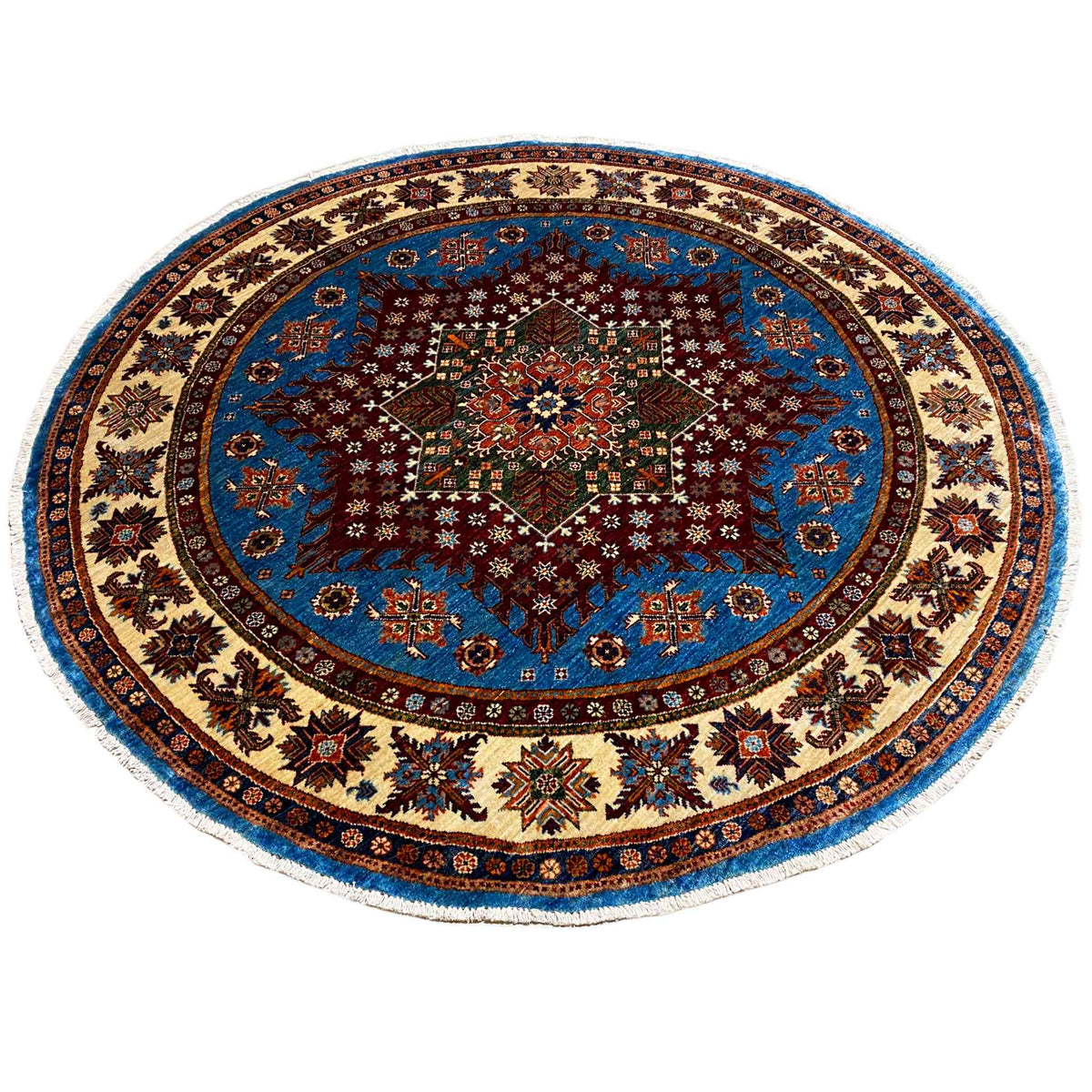 Round rug with a blue background, red central motif, and rich ornamental border