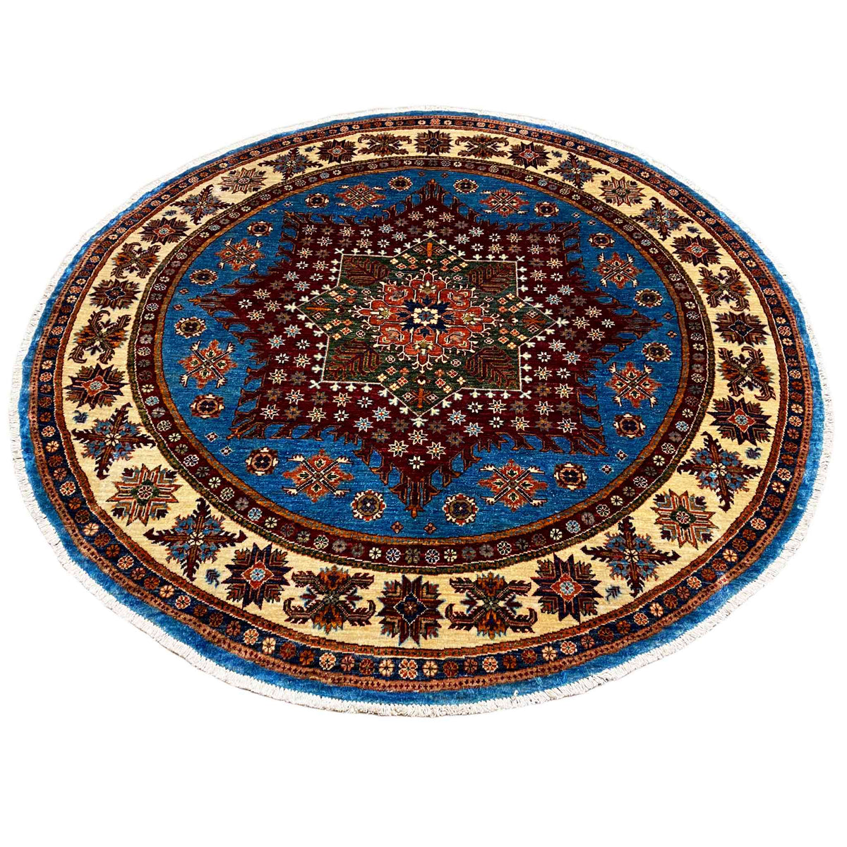 Round rug with a blue medallion, dark central star, and decorative border ornaments
