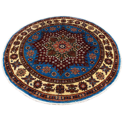 Round rug with a blue medallion, dark central star, and decorative border ornaments
