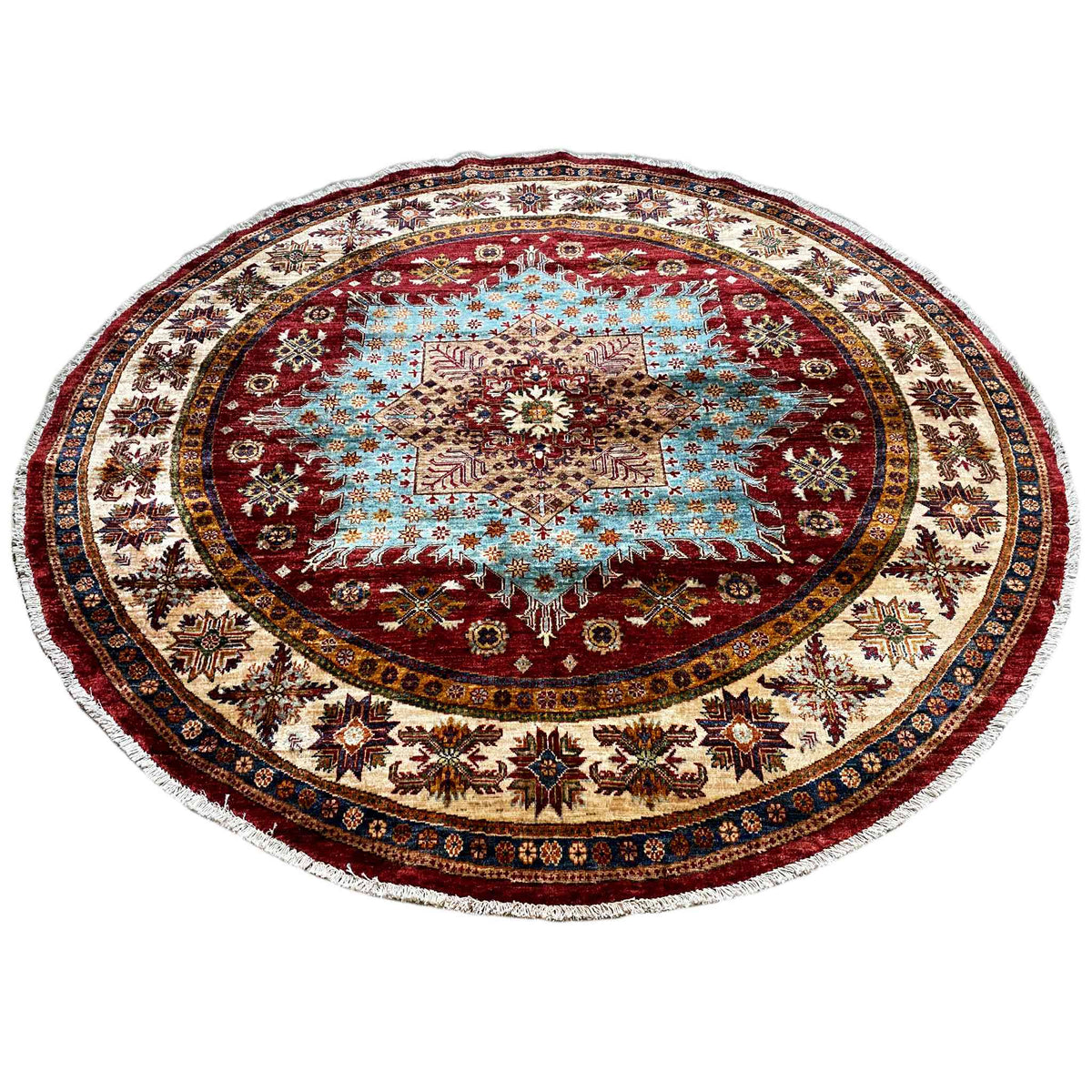 Round rug with blue ornamental inlay and decorative outer border