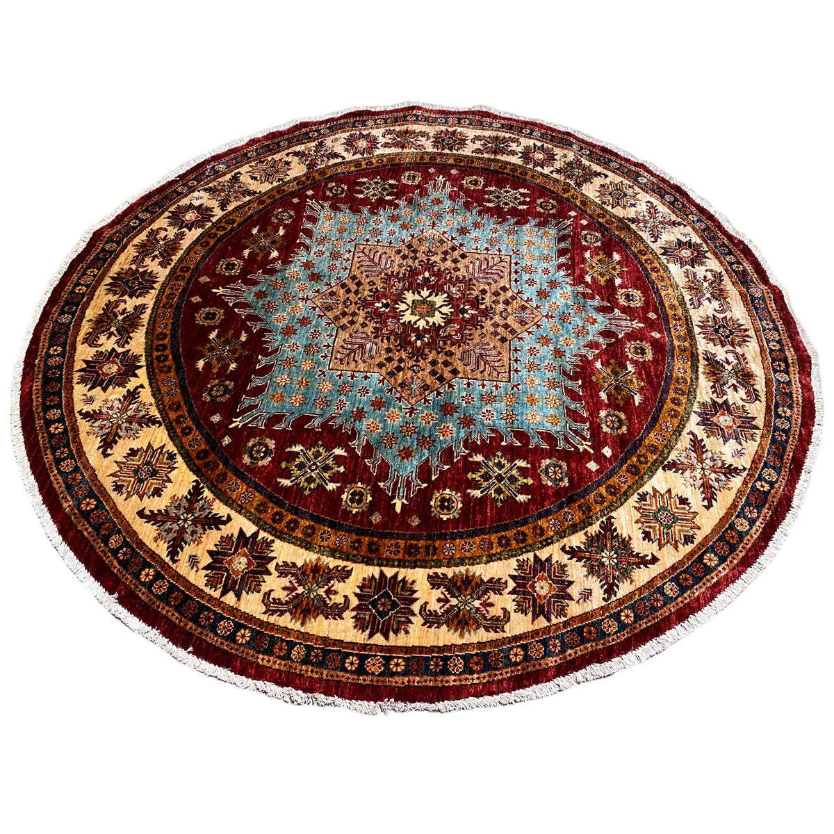Round rug with a central star medallion in brown, blue, and red