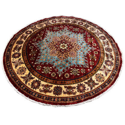 Round rug with a central star medallion in brown, blue, and red