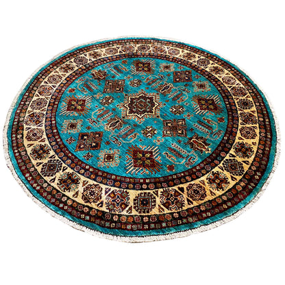 Round turquoise rug with star-shaped ornaments in the center and a dark border