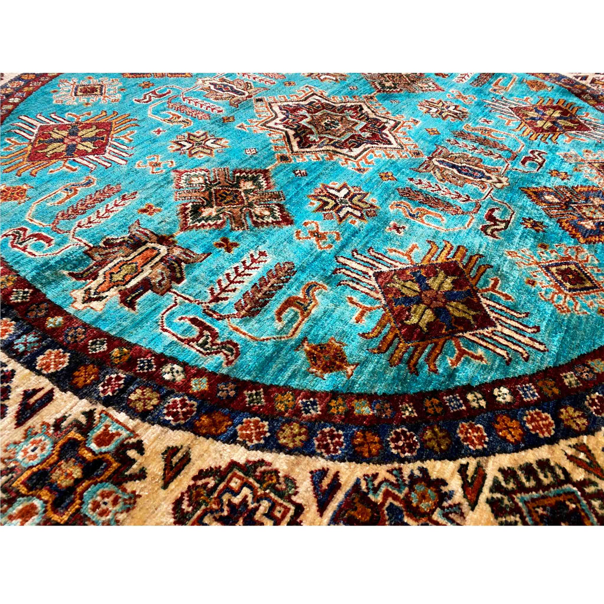 Carpet detail with turquoise pile and multicolored geometric ornaments