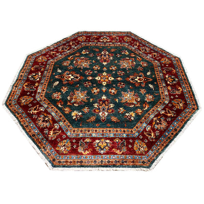 Octagonal rug with ornamental designs and a central motif in teal and red