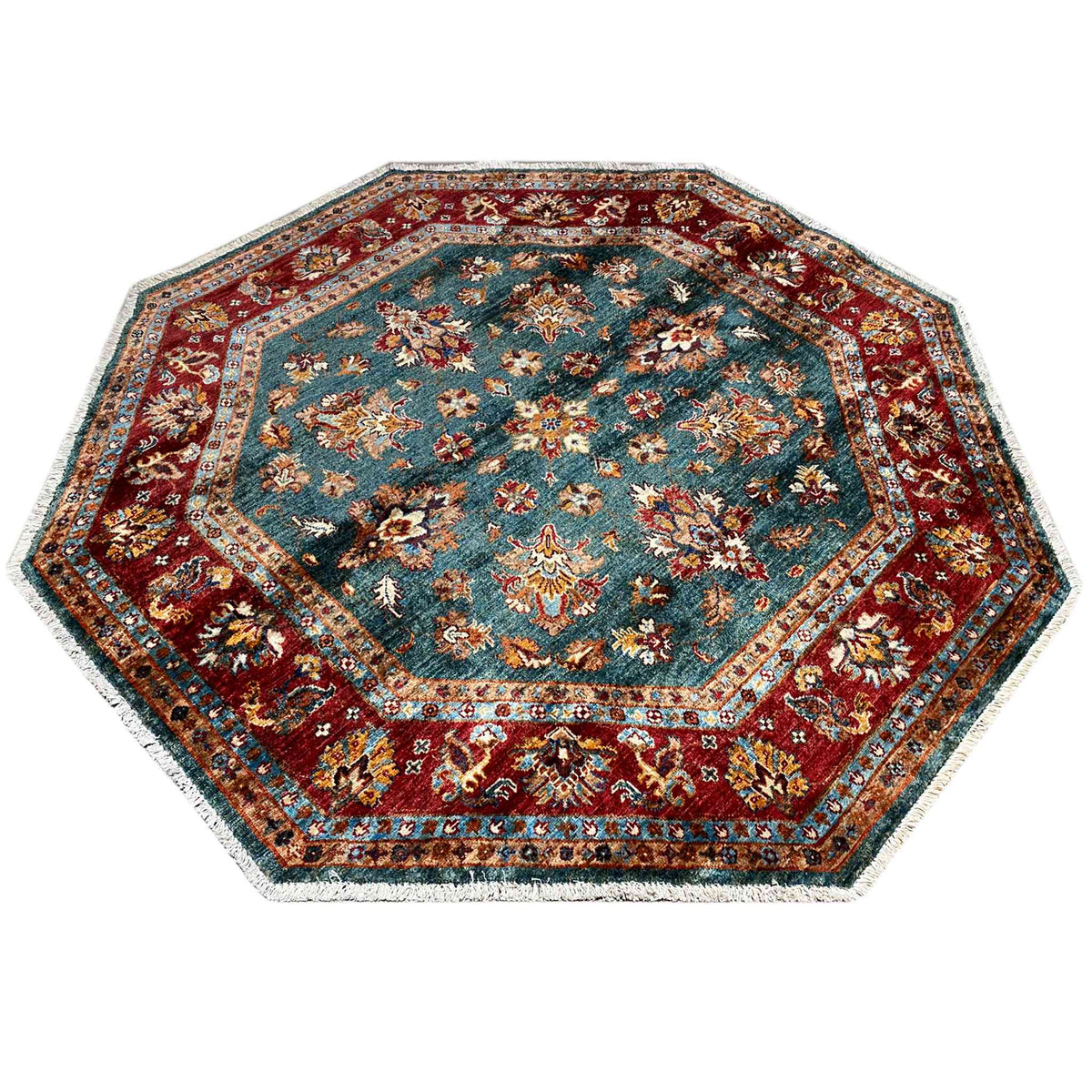 Octagonal rug with a decorative border and floral motifs in petrol blue