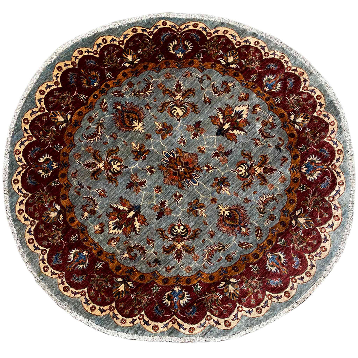 Round Kazak rug (176×175 cm) with light blue pile and a red ornamental border, colorfully embroidered.