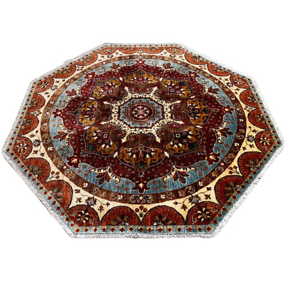 Octagonal rug with a dense paisley pattern and central rosette, red, blue and beige.