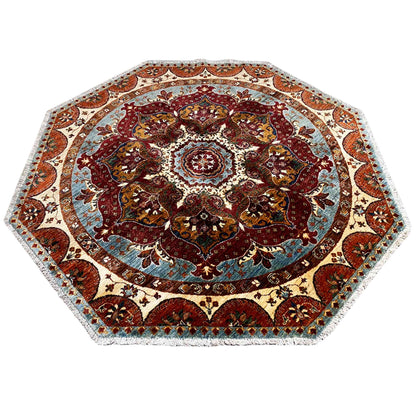 Octagonal rug with a symmetrical ornamental border and central rosette, in red and blue tones.