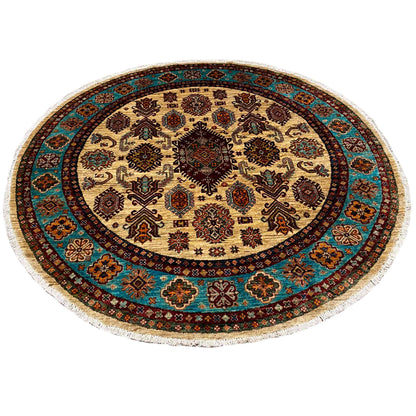 Round rug with an ornamental border in turquoise, cream, and dark brown