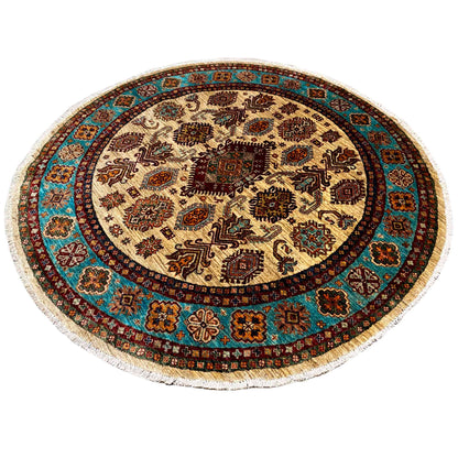 Round rug with a finely patterned central motif and turquoise border trim