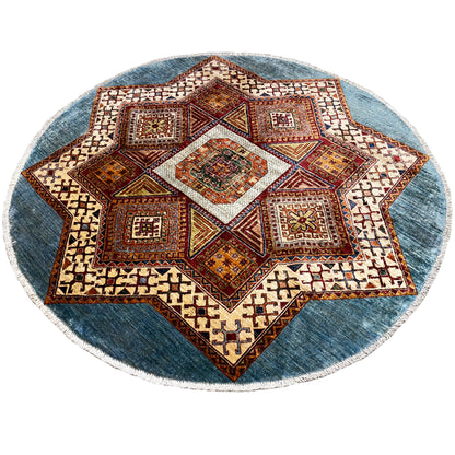 Round Kazakh rug with a centered star, colorful geometric motifs, blue border