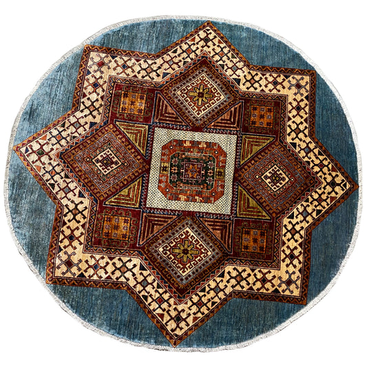 Round Kazakh rug with star pattern, blue border, and multicolored ornaments