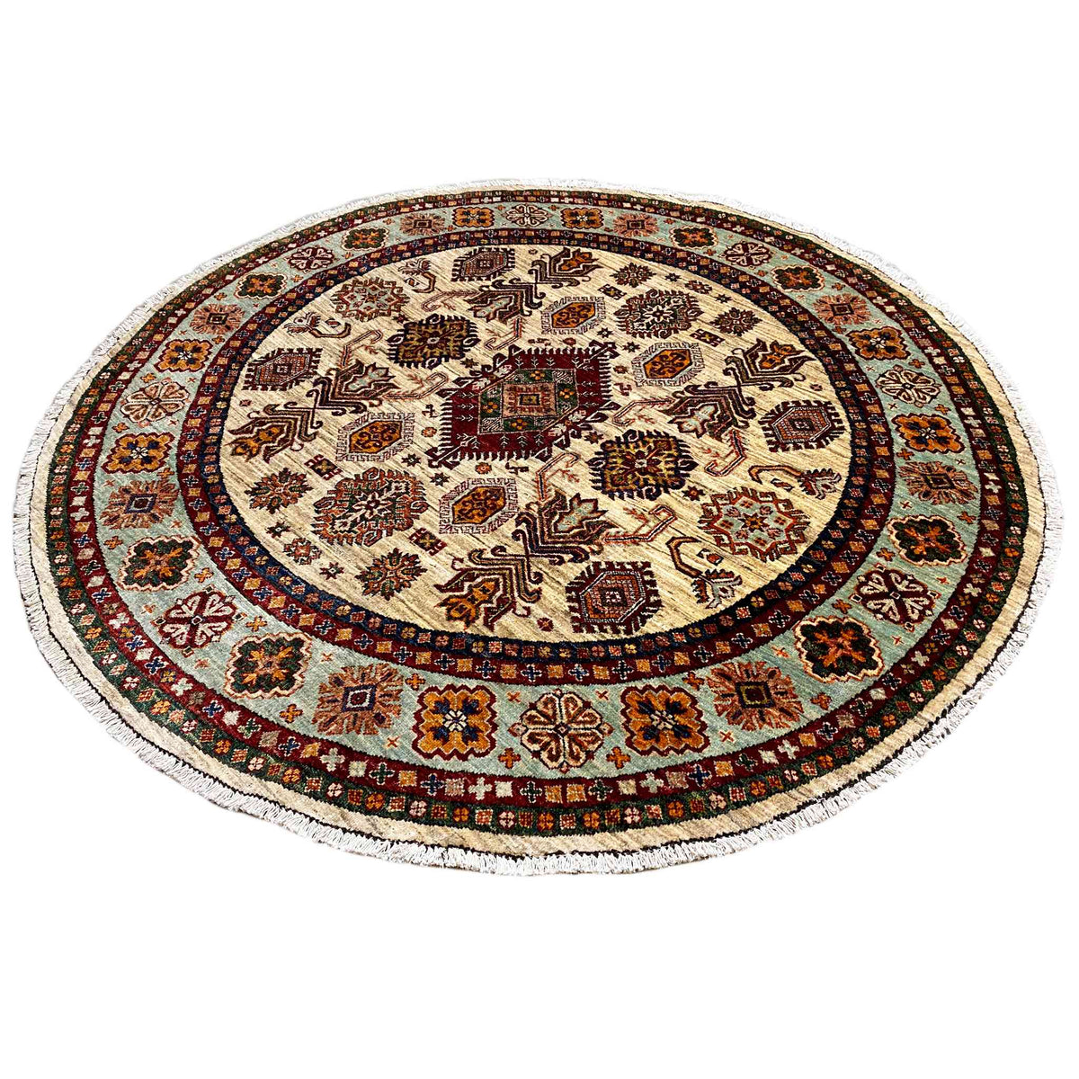 Round rug with a beige base, dark ornaments, and a red/brown border, densely woven