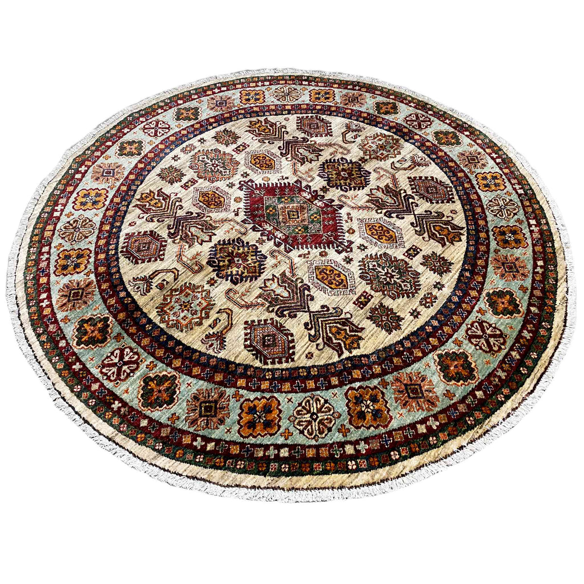 Round rug with a beige background, detailed ornamental pattern, and multicolored border