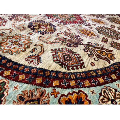 Close-up: woven rug with a beige background, colorful ornaments, and a decorative border