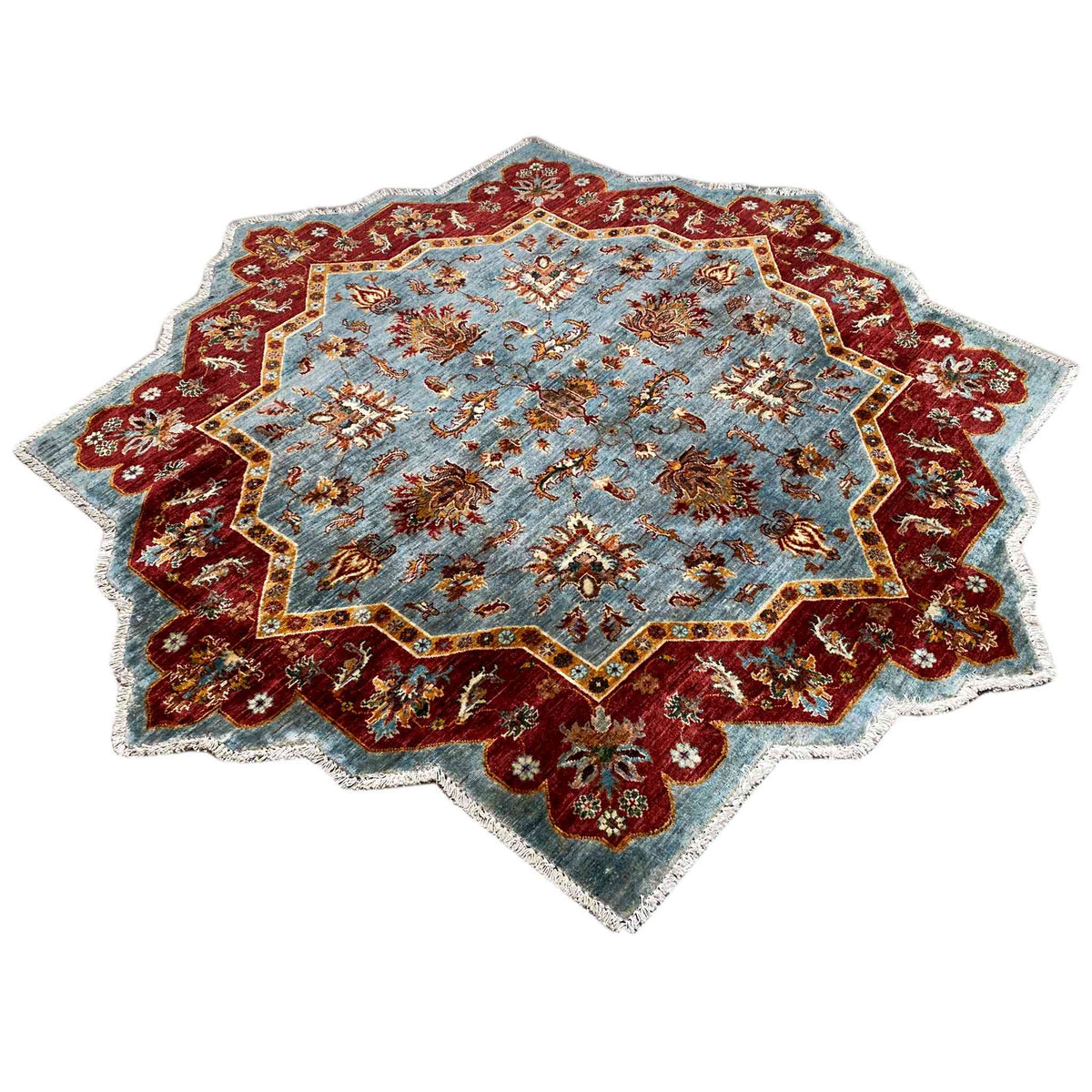 Rug with a light blue center, wine-red border, and colorful ornaments