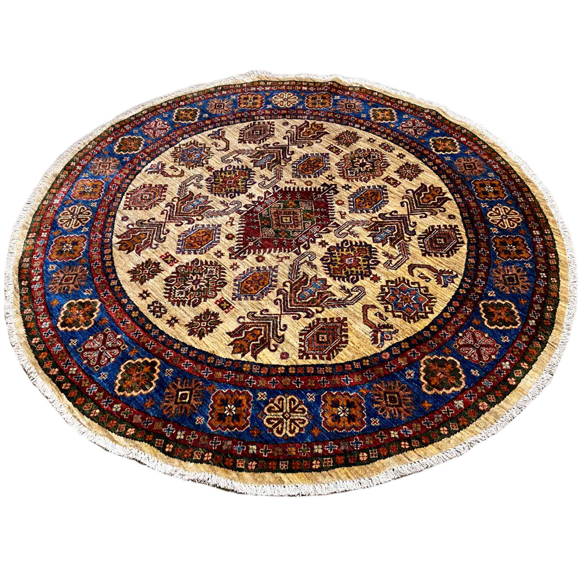 Round rug with an intricate pattern in blue, red, and brown on a light background