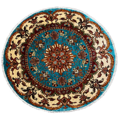 Round rug with a turquoise medallion, brown ornament, beige background, and floral design.