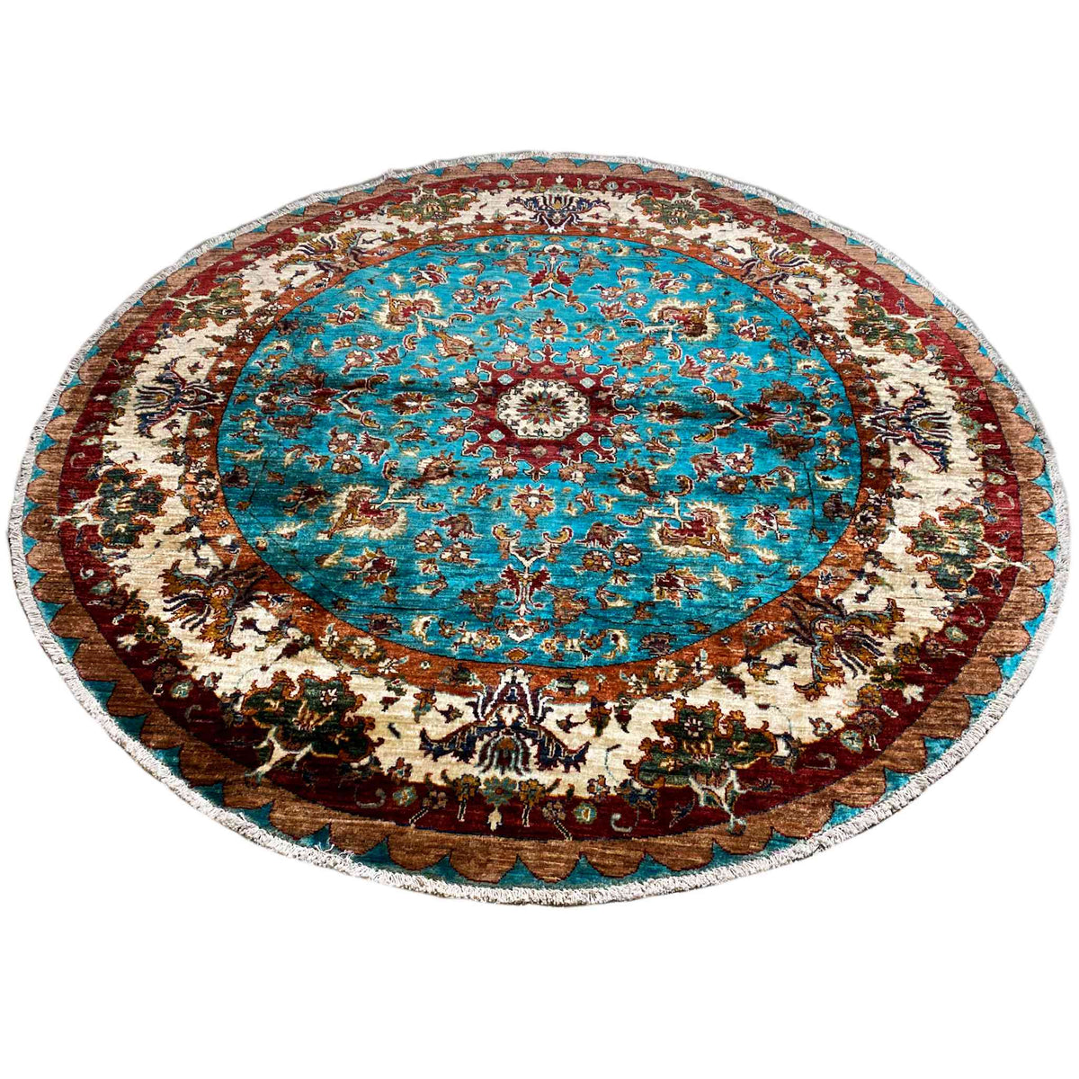 Round rug with a central turquoise medallion and reddish-brown border