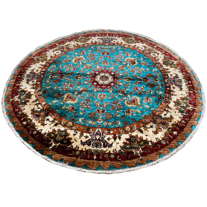 Round rug with a central turquoise medallion and reddish-brown border