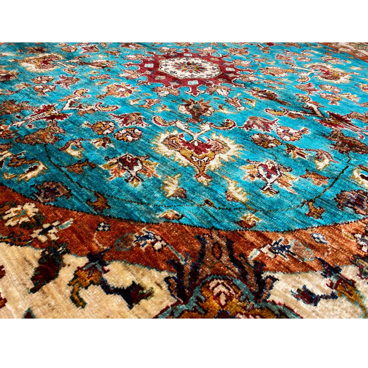 Carpet surface with turquoise ornaments, beige and brown color accents