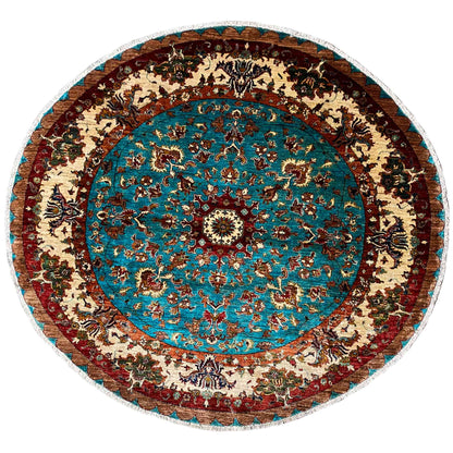 Round rug with a turquoise and beige ornamental pattern and a wide bordered edge