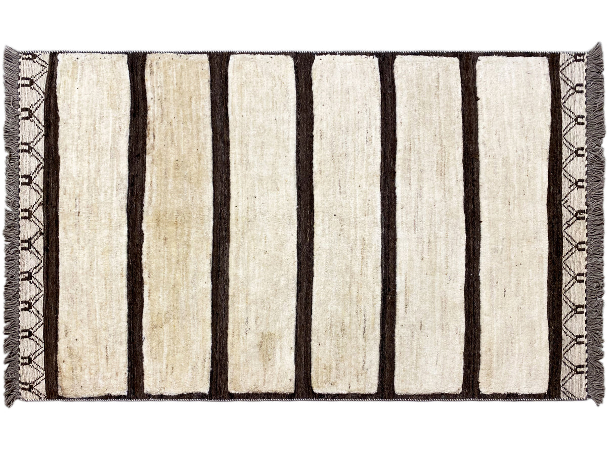 Rectangular kilim Gabbeh rug with vertical cream-colored and dark stripes, fringes
