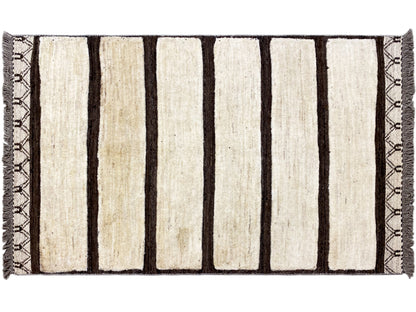 Rectangular kilim Gabbeh rug with vertical cream-colored and dark stripes, fringes