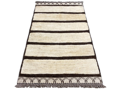 Rectangular rug with horizontal cream-colored stripes and a dark border, fringes