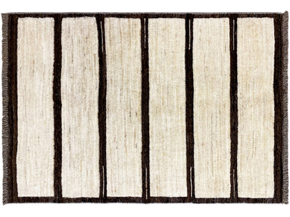 Rectangular kilim rug with vertical beige stripes and a dark border, fringes on the sides.