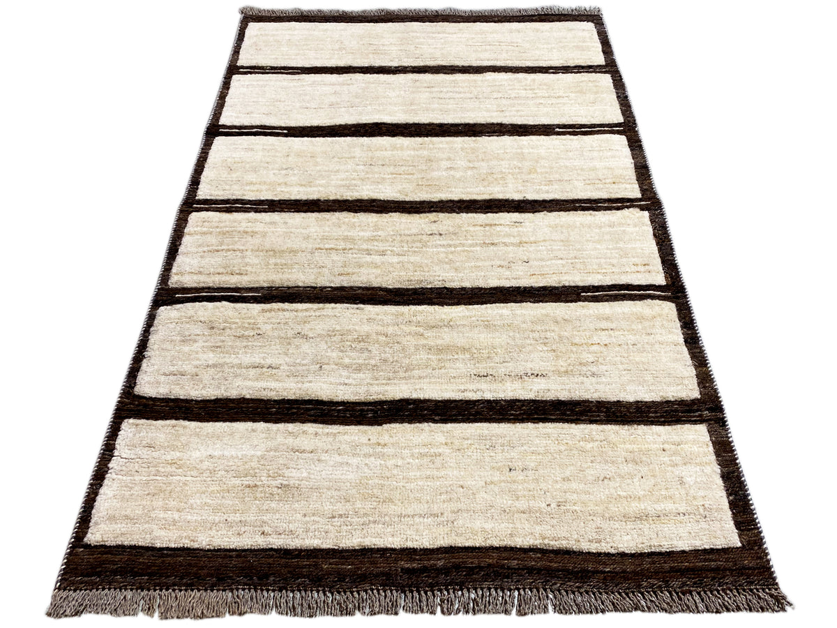 Beige and dark brown striped kilim rug, rectangular, with a fringed edge.