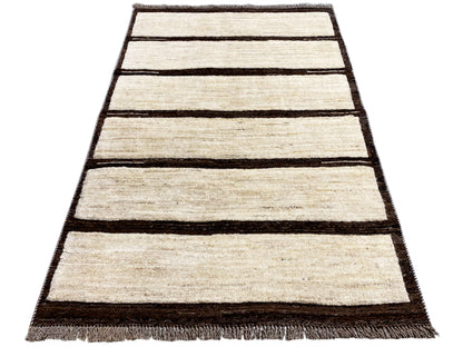 Beige and dark brown striped kilim rug, rectangular, with a fringed edge.