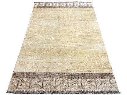 Gabbeh kilim rug, trapezoidal view with a cream-colored pattern and dark brown finishing border