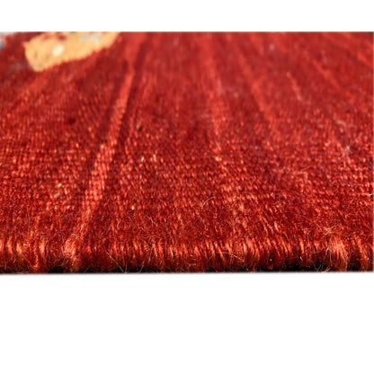 Detailed view of the rug edge: red kilim with fringes and woven texture