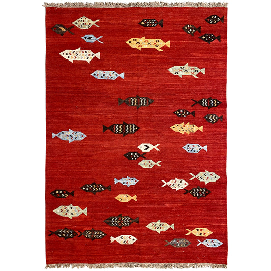 Red kilim rug with patterned motifs and fringes, flat-woven