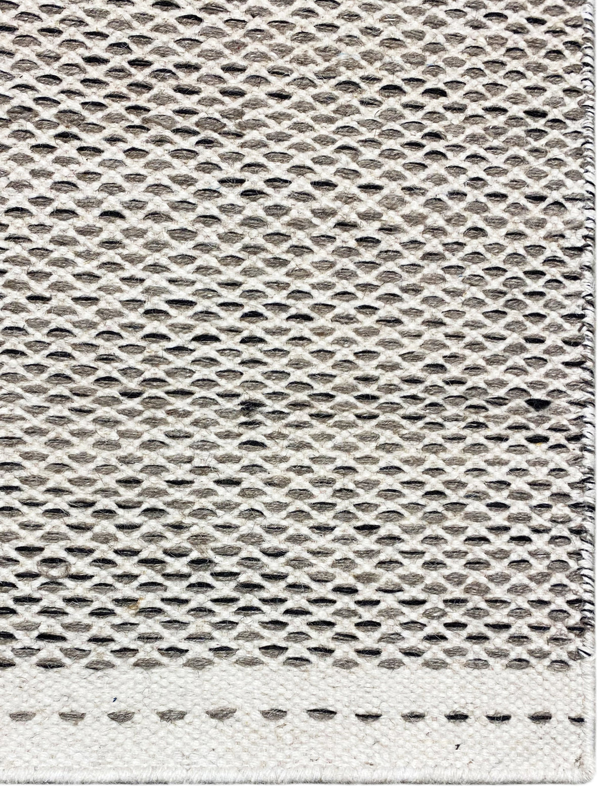 Kelim rug in silver with a relief weave texture, close-up, dotted decorative border