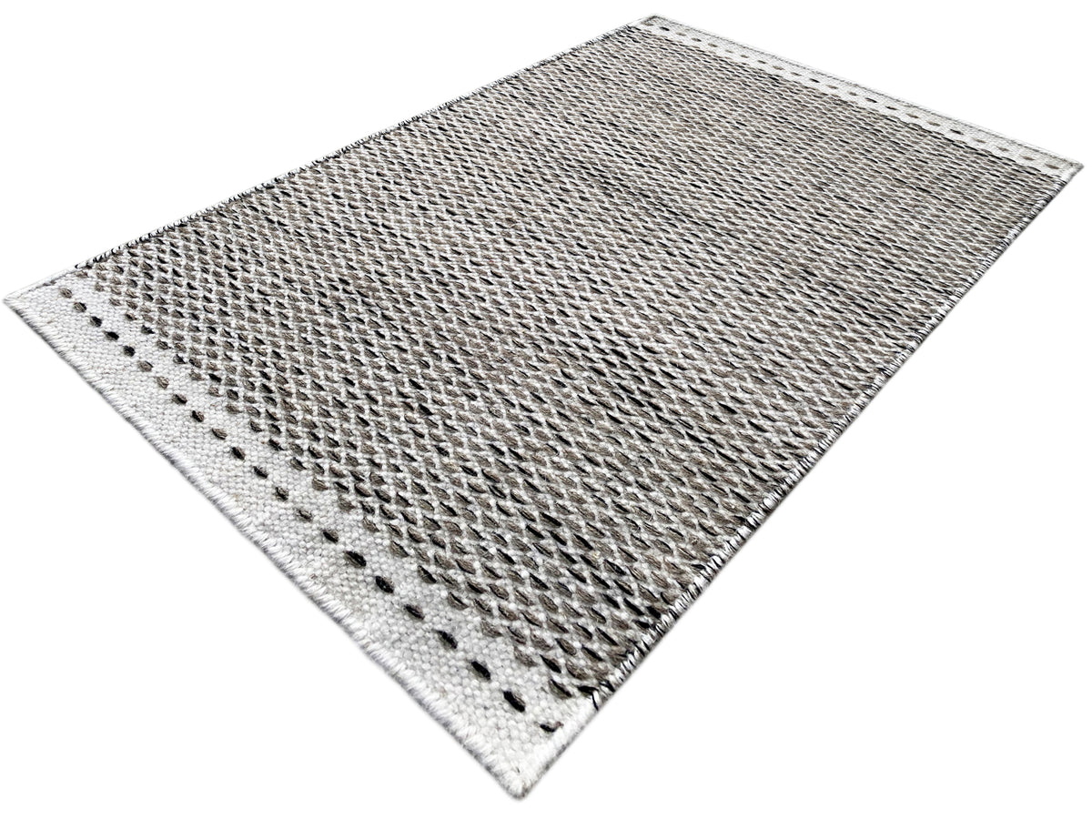 Gray kilim rug 60x90 cm, diagonal view, bound edge on both sides