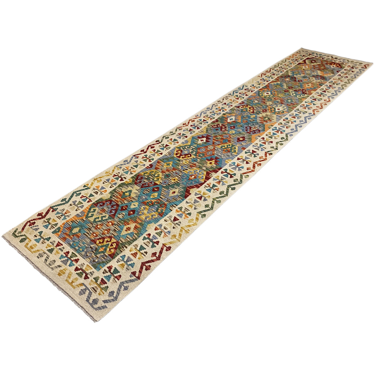 Kilim runner with a central field and decorative border pattern, featuring a colorful design
