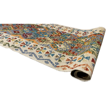 Kilim runner with the underside visible at the twisted end, featuring a colorful pattern