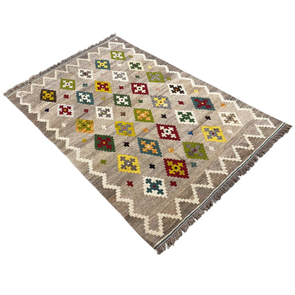 Kilim rug with colorful cross and diamond patterns, diagonal view, zigzag edges